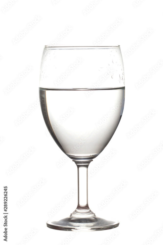 Half water in wine glasses . Isolated on white Half water in wine glasses . Isolated on white