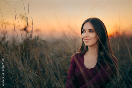 Fashion Portrait of a Happy Woman Admiring Sunset  © nicoletaionescu