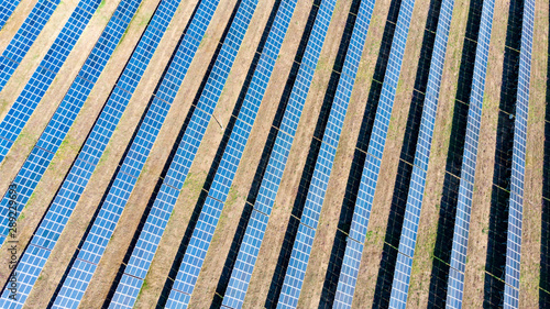 solar panels, desert. Solar energy farm. Top view of solar panels on the energy farm. Aerial view of the solar power plant. Industrial background on renewable resources.  large photovoltaic complex