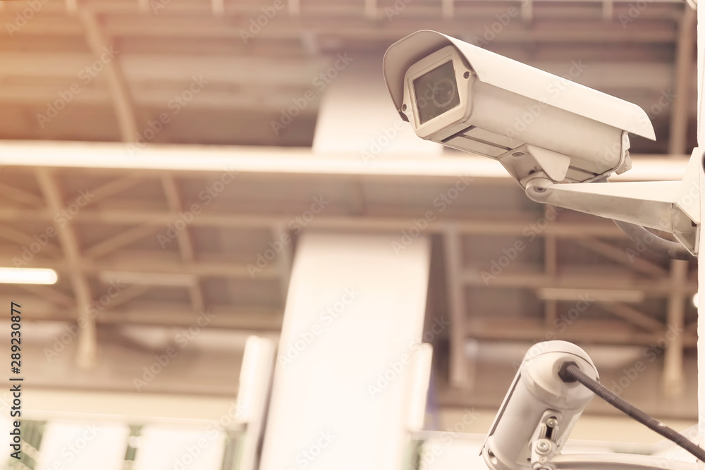 Security cctv camera or surveillance system on the white wall. CCTV on the white wall at the parking lot. Security cctv camera or surveillance system on the white wall. CCTV on the white wall at the parking lot.
