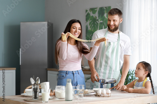 Happy family making homemad...