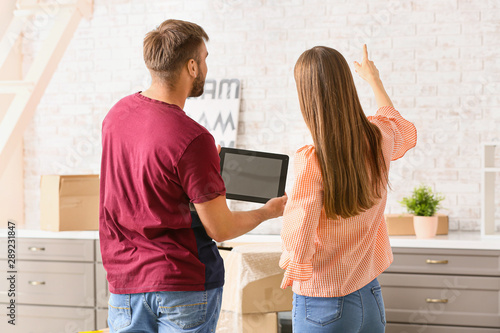 Young couple with tablet co...