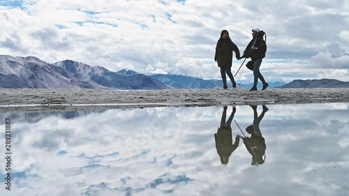 Young couple enjoying vacation in Pangong lake in Ladakh