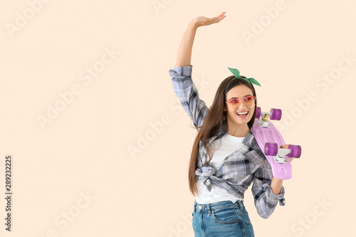 Dancing young woman with sk...