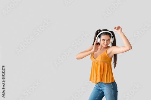 Beautiful young woman liste...