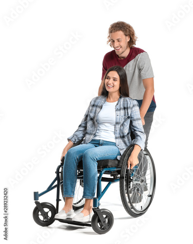 Happy woman in wheelchair and with husband on white background
