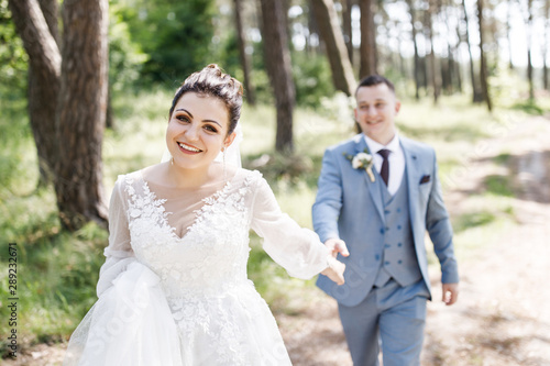 Wedding day. The bride and groom have fun outdoors on their wedding day