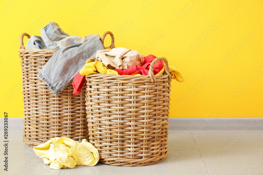 Baskets with dirty laundry on floor - obrazy, fototapety, plakaty 