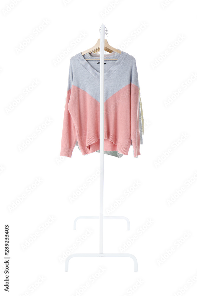 Rack with hanging clothes on white background Rack with hanging clothes on white background