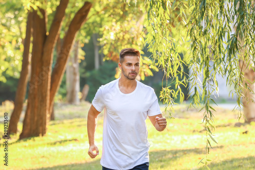 Handsome sporty man running...