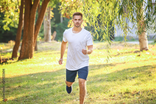 Handsome sporty man running...