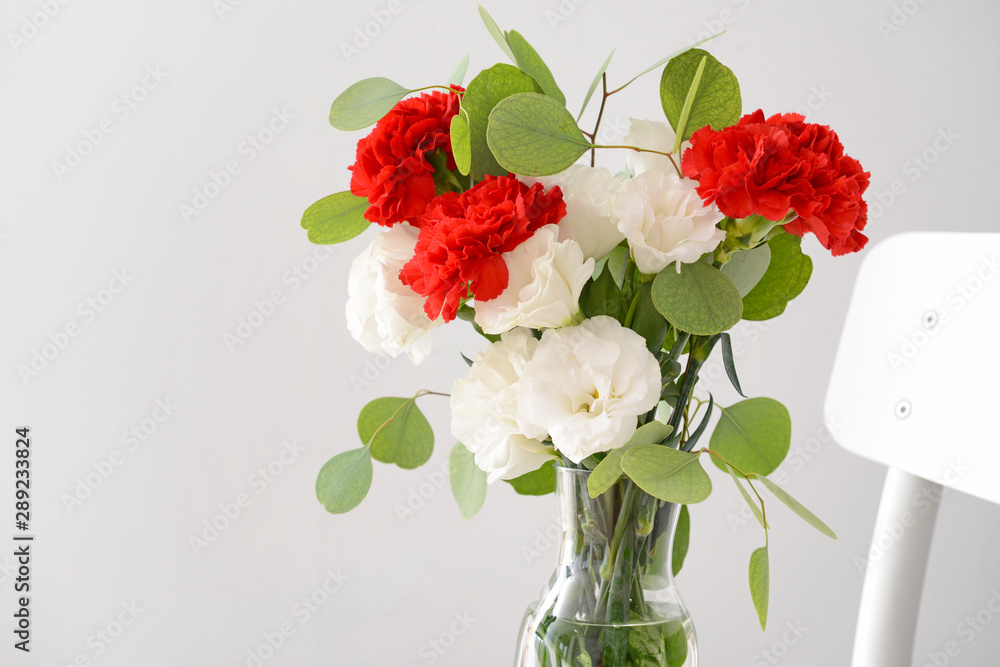 Obraz premium Bouquet of beautiful flowers on light background