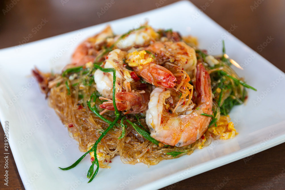 Stir-fried vermicelli with shrimp and climbing wattle vegetable.