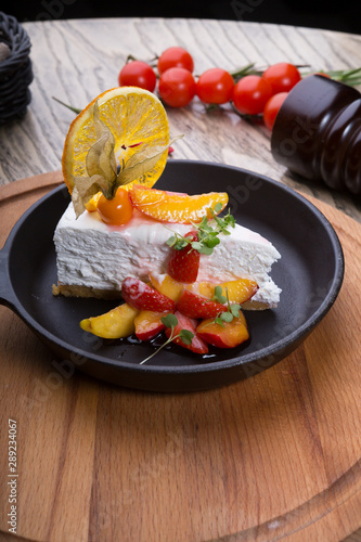 Slice of cheese cake decorated with berries