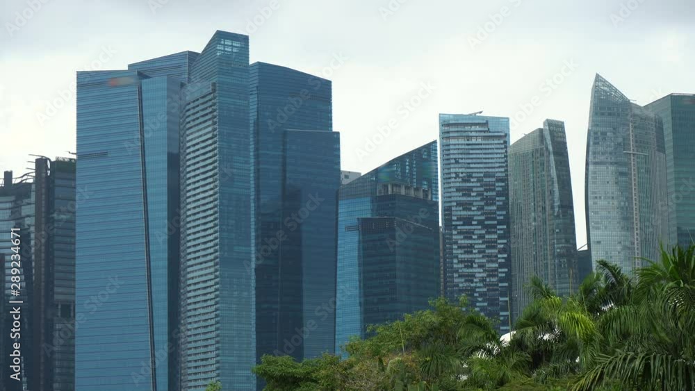 Glass Facade of Modern Office Skyscrapers in Finance District of Singapore Glass Facade of Modern Office Skyscrapers in Finance District of Singapore