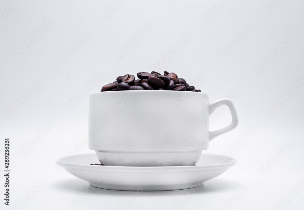coffee beans in the cup on white background coffee beans in the cup on white background