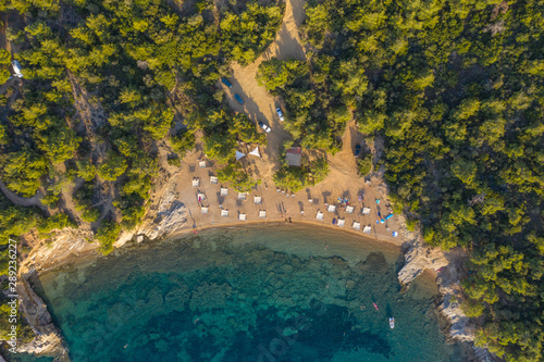 Aerial drone view of beach umbrellas and sunbeds