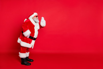 Full body photo of modern in coat gloves cuffs fur grey-haired cheerful optimistic St Nicholaus calling his elf helpers deer reindeer to help in workshop isolated bright background
