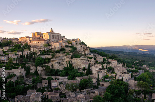 Town viewpoint of Gordes, a small medieval town in Provence, France. A sunset view of the ledges of the roof of this beautiful village.