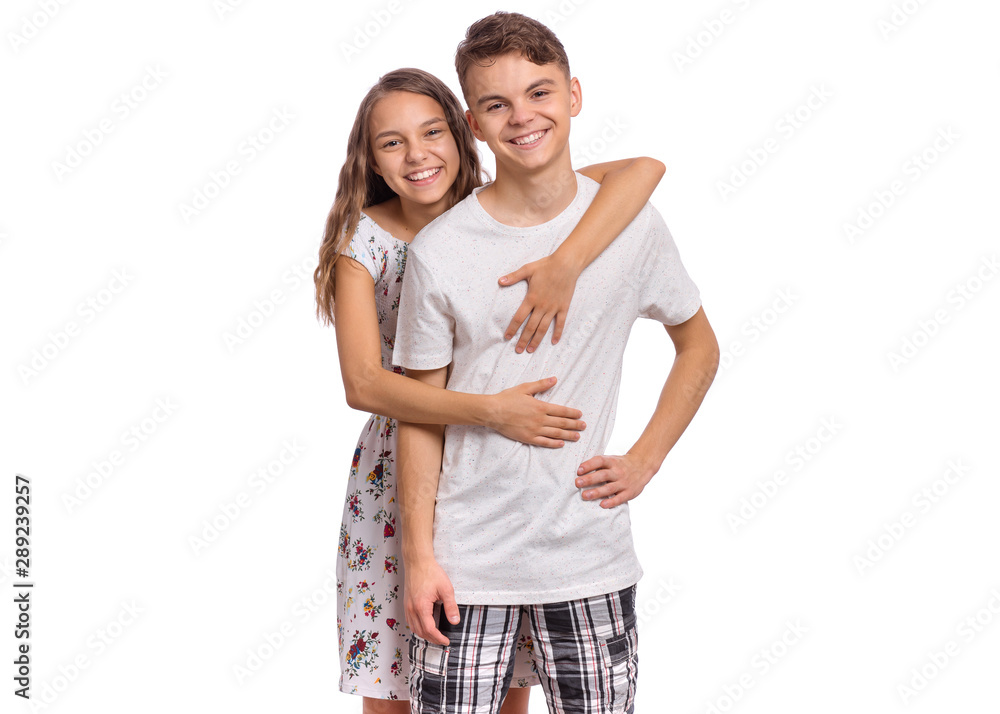Sweet young couple in love. Happy teenagers standing together and ...
