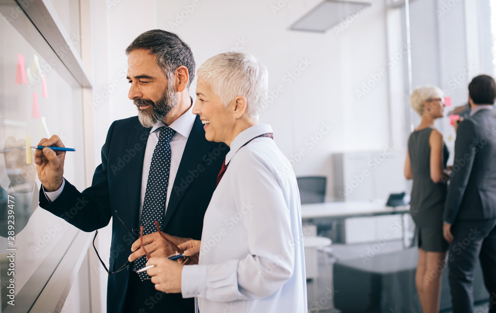 Business people working discussing as a team at the office Business people working discussing as a team at the office