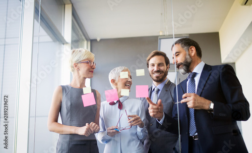 Group of happy business people working in a meeting at office