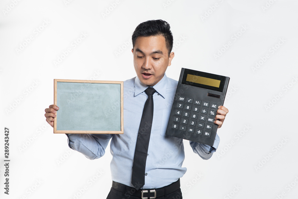 Man holding a big calculator and blank board Man holding a big calculator and blank board