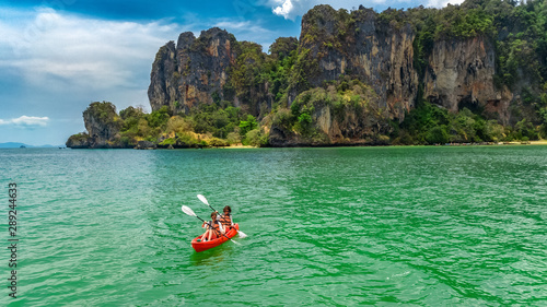 Family kayaking, mother and daughter paddling in kayak on tropical sea canoe tour near islands, having fun, active vacation with children in Thailand, Krabi