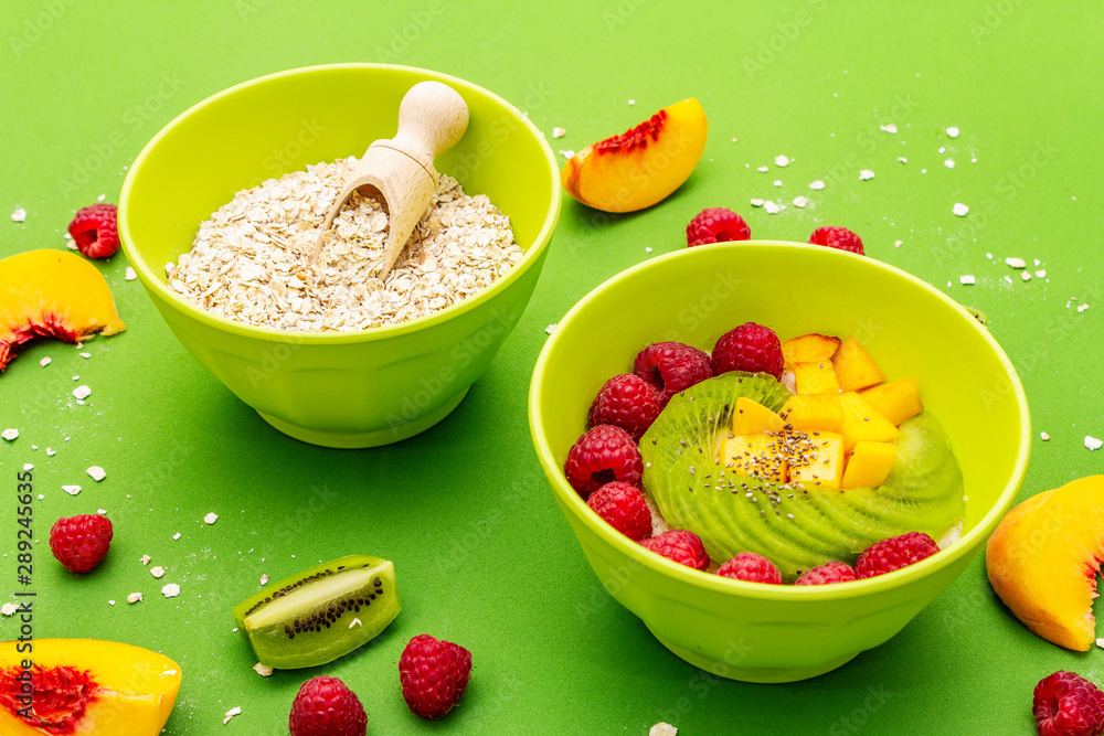 Oatmeal bowl with fresh berries and fruits Oatmeal bowl with fresh berries and fruits