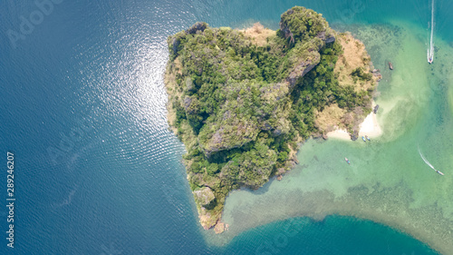 Aerial drone view of tropical islands, beaches and boats in blue clear Andaman sea water from above, beautiful archipelago islands of Krabi, Thailand © Iuliia Sokolovska