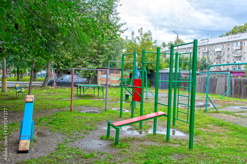 Children's playground after rain in the usual courtyard of an apartment building. provincial town. summer. Russia 