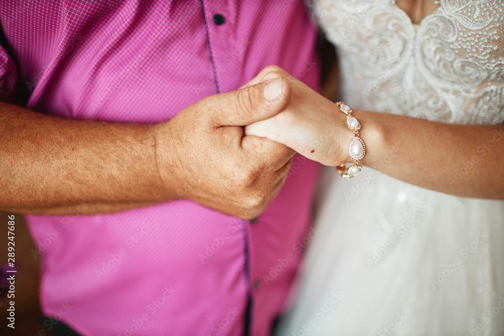 man and woman holding hands