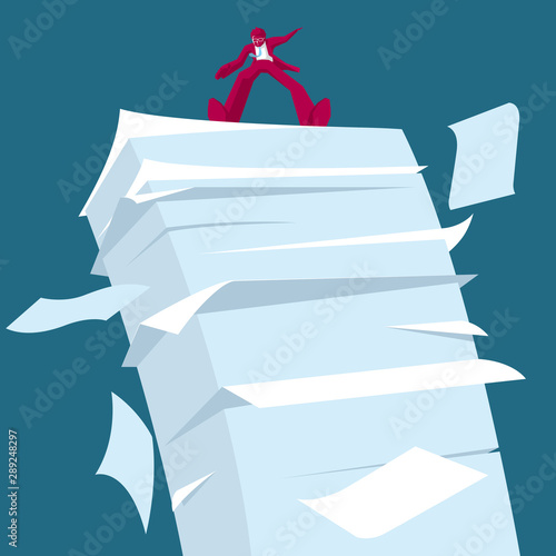 Businessman standing on top of a pile of documents. Isolated on blue background.