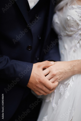 man and woman holding hands