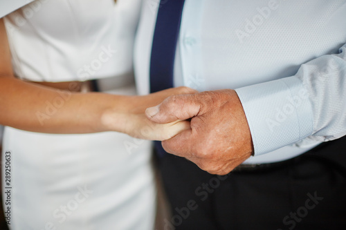 man and woman holding hands