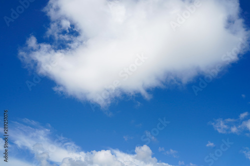 Blue sky and white clouds background.