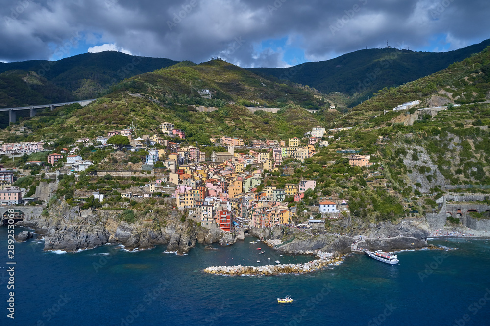 Panorama view of Riomaggiore village one of Cinque Terre in La Spezia, Italy. Flight by a drone.