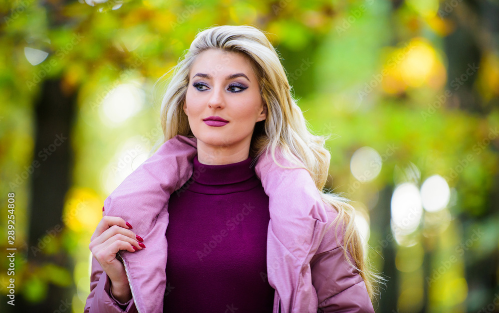 Autumn hair care is important so as to avoid dry frizzy hair. Girl fashionable blonde walk in autumn park. Autumn hair care concept. Cold blonde concept. How to repair bleached hair fast and safely Autumn hair care is important so as to avoid dry frizzy hair. Girl fashionable blonde walk in autumn park. Autumn hair care concept. Cold blonde concept. How to repair bleached hair fast and safely