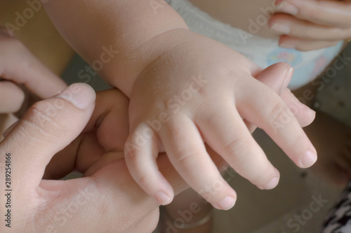 hands of mother and baby