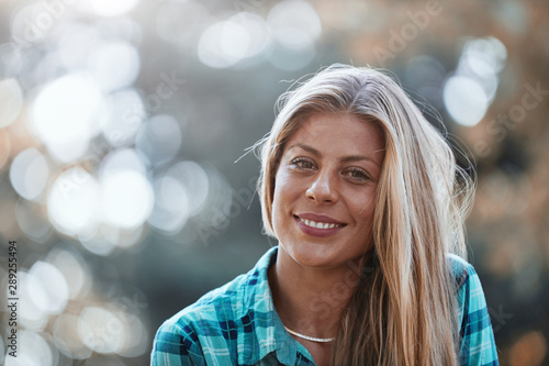 Young woman enjoying in autumn colored nature.