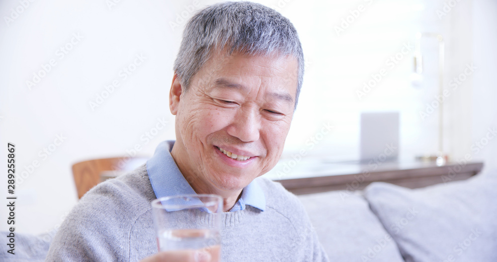 old asian man drink water