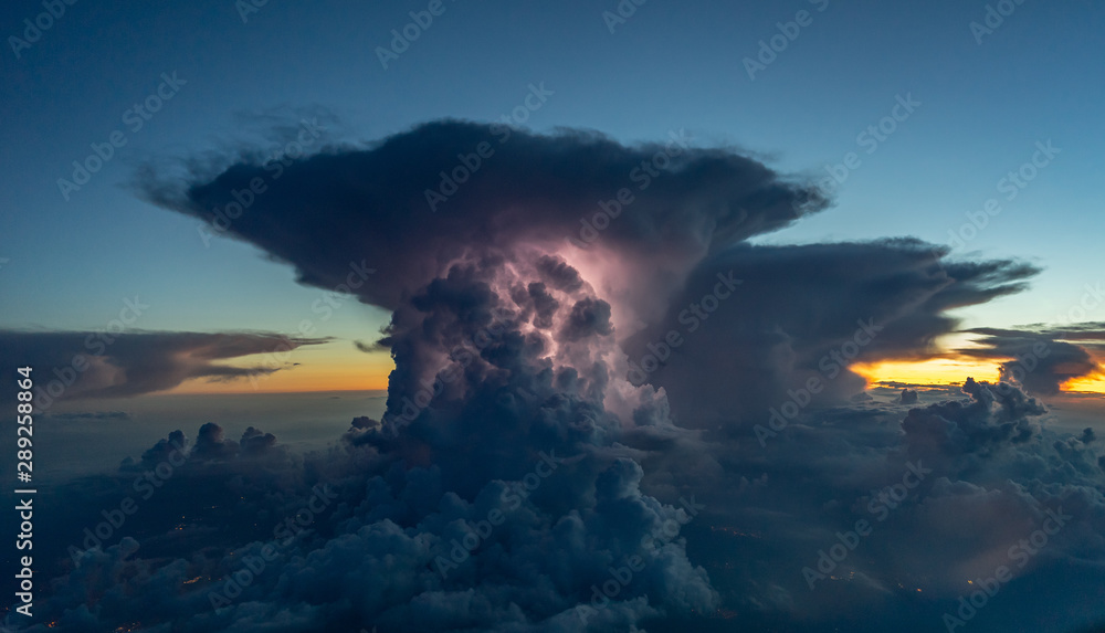 Fototapeta premium Thunderstorm with some lightning during sunset