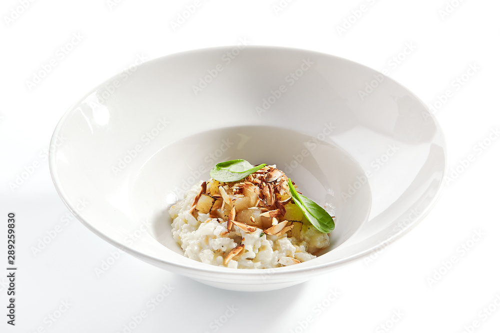 Risotto with roasted pear and almond closeup Risotto with roasted pear and almond closeup
