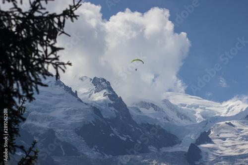 Paragliding over Mont Blanc massif in the French Alps above Chamonix