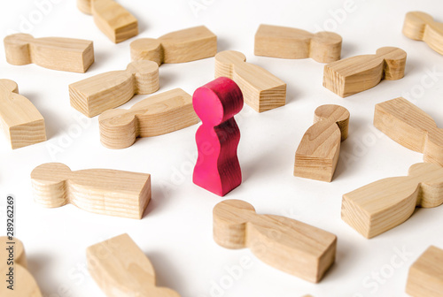 The figure of a woman is stand among of lying figures of men. Fans and favorites. Man search concept for relationships. Choosing a partner, picky and arrogant. A blind date