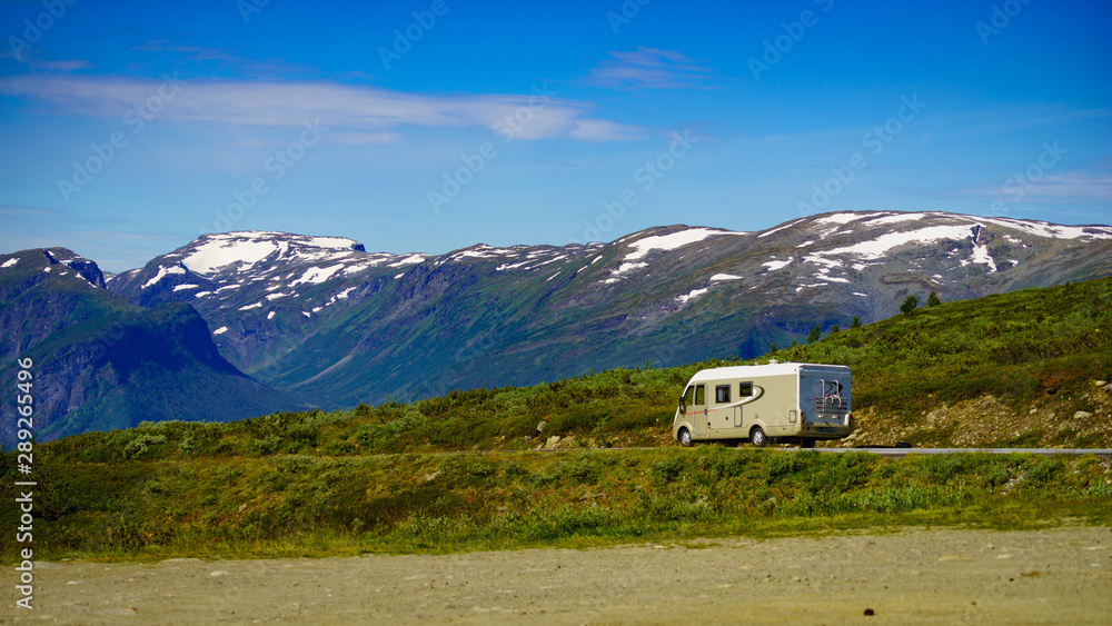 Camper car on road in norwegian mountains