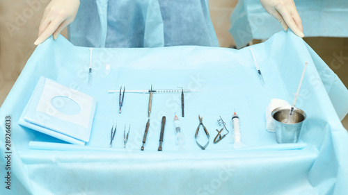 Ophthalmology laser microscope operation. Clinic room with doctor and parient. Gloves and medicine tools photo