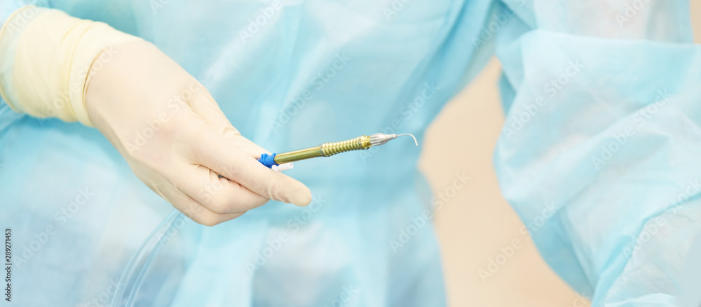 Ophthalmology laser microscope operation. Clinic room with doctor and parient. Gloves and medicine tools Ophthalmology laser microscope operation. Clinic room with doctor and parient. Gloves and medicine tools