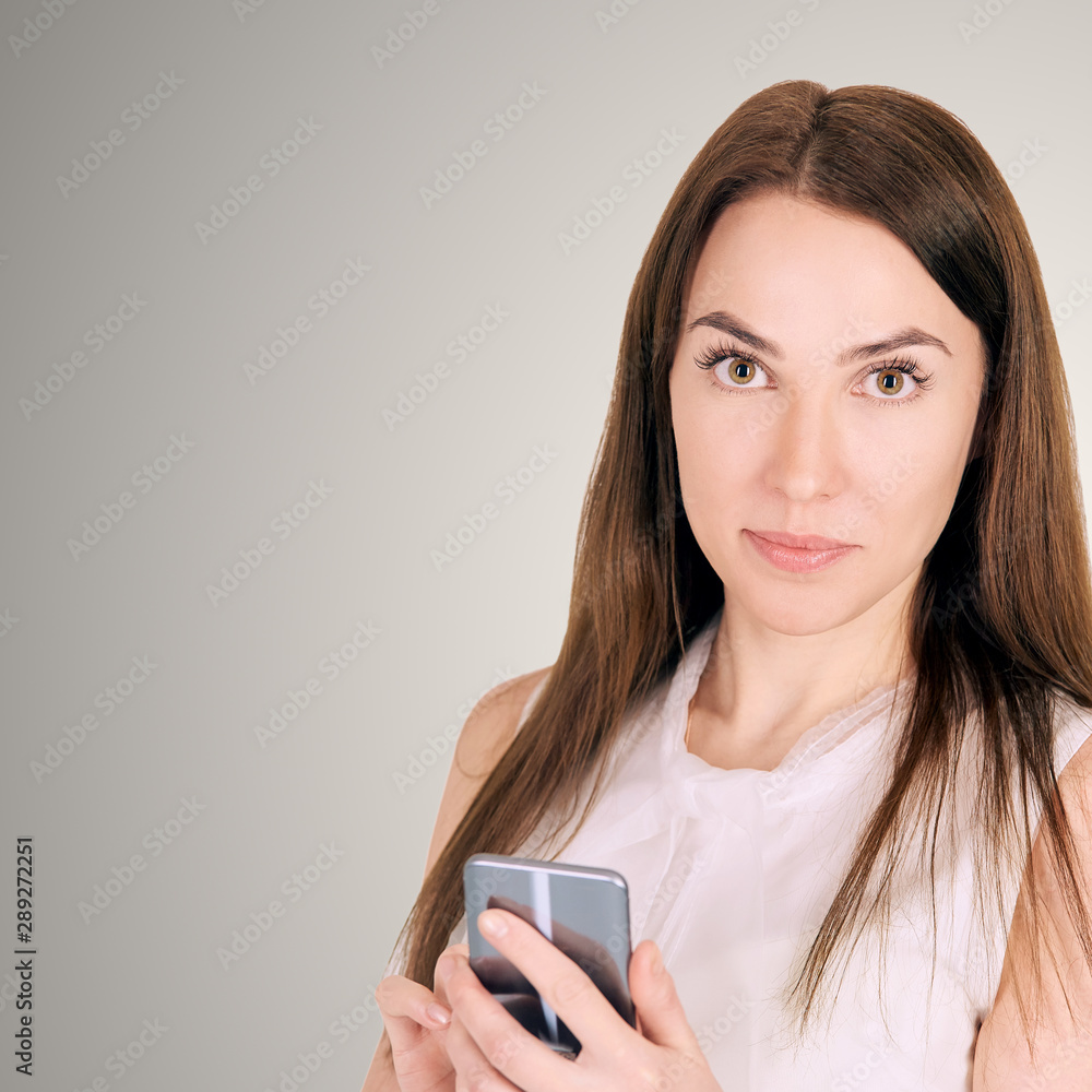 Young girl with mobilephone. Business woman write on screen. Adorable caucasian businesswoman texting to friend Young girl with mobilephone. Business woman write on screen. Adorable caucasian businesswoman texting to friend
