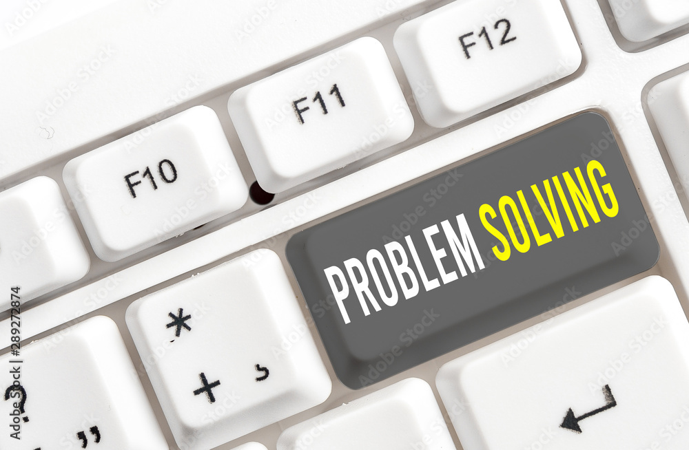 Writing note showing Problem Solving. Business concept for process of finding solutions to difficult or complex issues White pc keyboard with note paper above the white background Writing note showing Problem Solving. Business concept for process of finding solutions to difficult or complex issues White pc keyboard with note paper above the white background